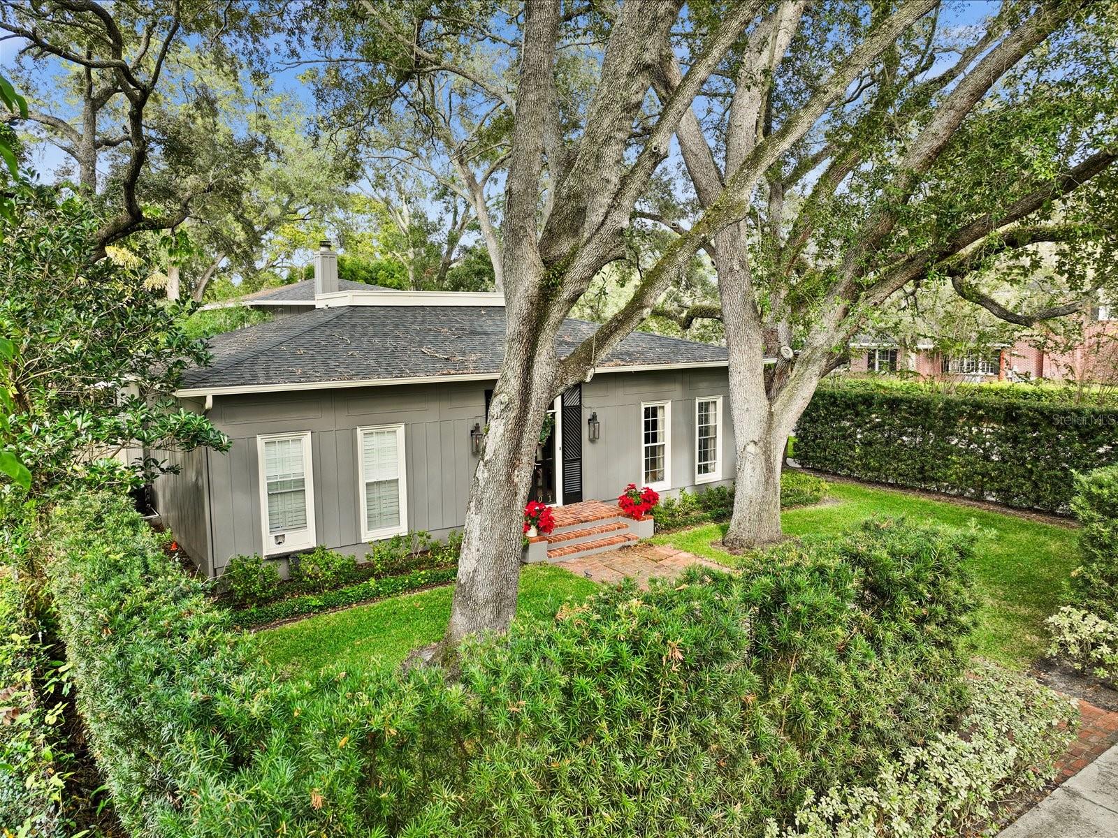 Mature hedge creates natural fence and ultimate in privacy.