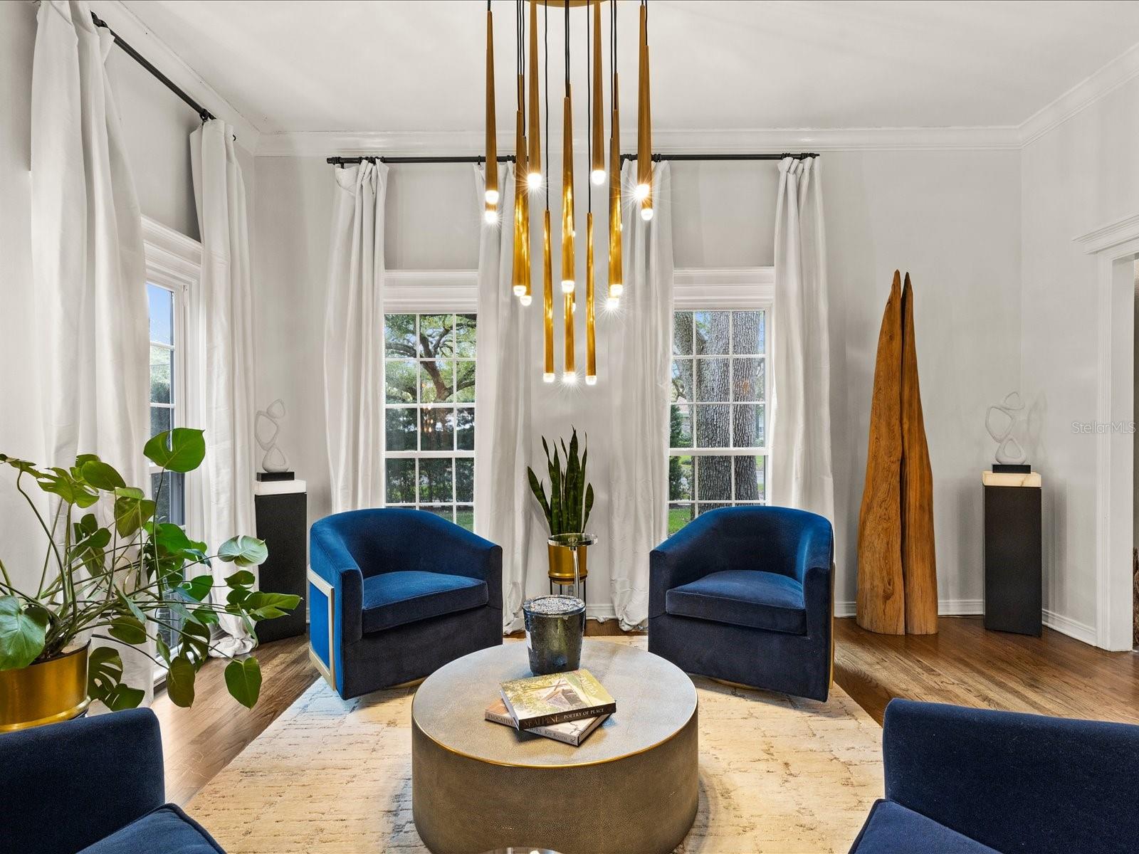 Front Living Room.  High Ceilings with floor to ceiling windows, wood floors.