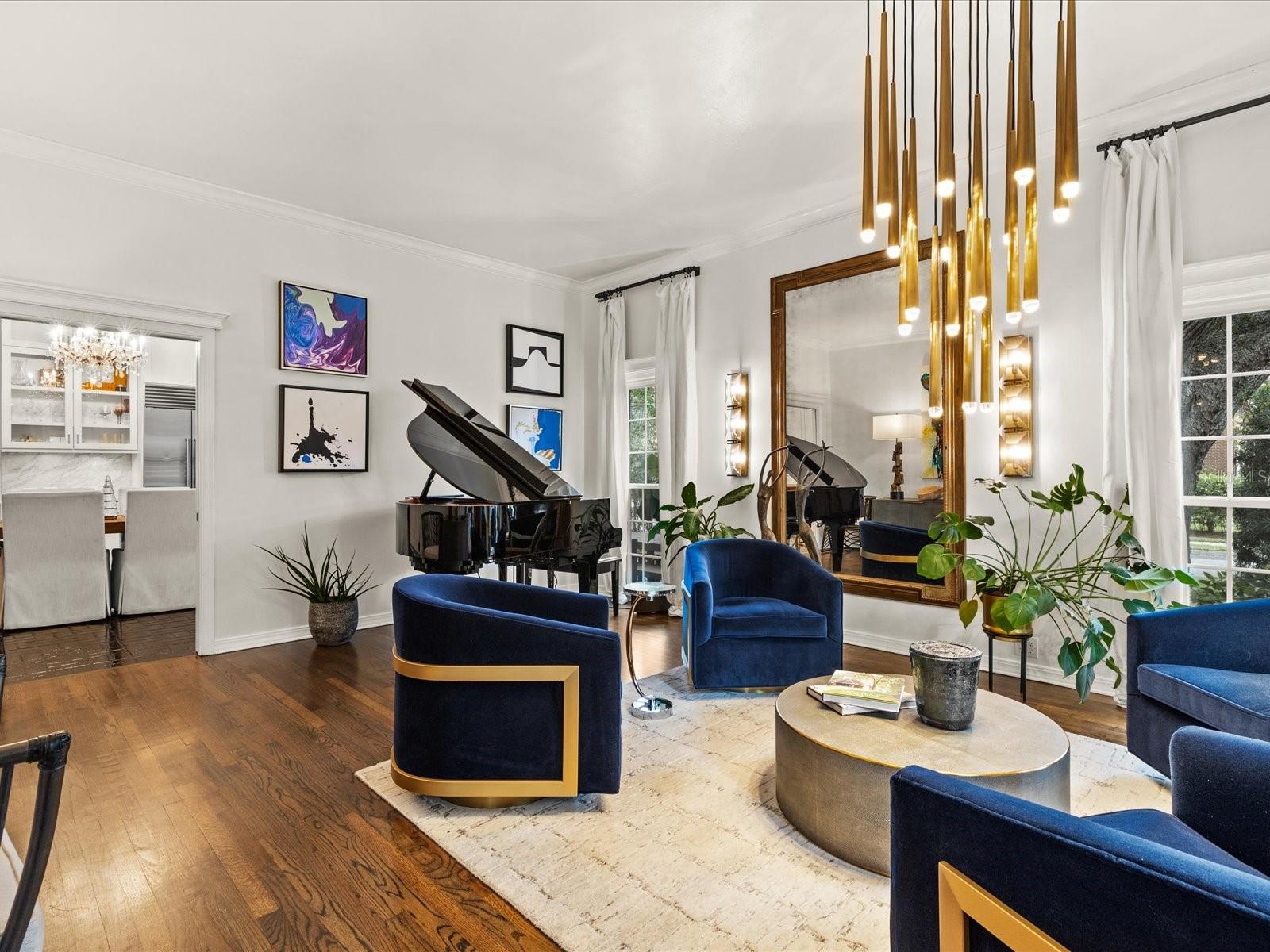 Front Living Room.  High Ceilings with floor to ceiling windows, wood floors.