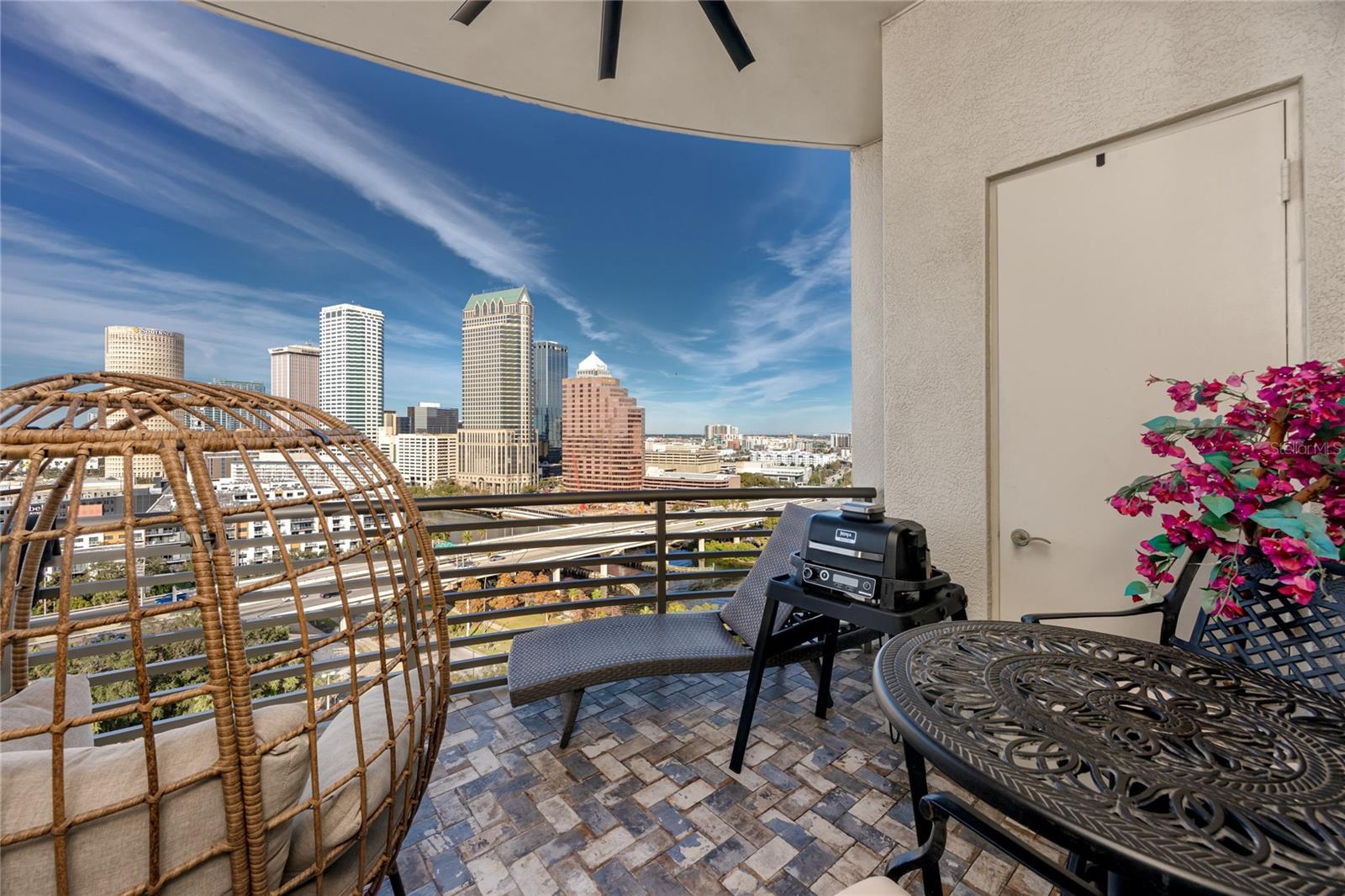 Outside patio has paver floors, new ceiling fan, and outdoor storage plus awesome views of the River & Downtown Tampa.