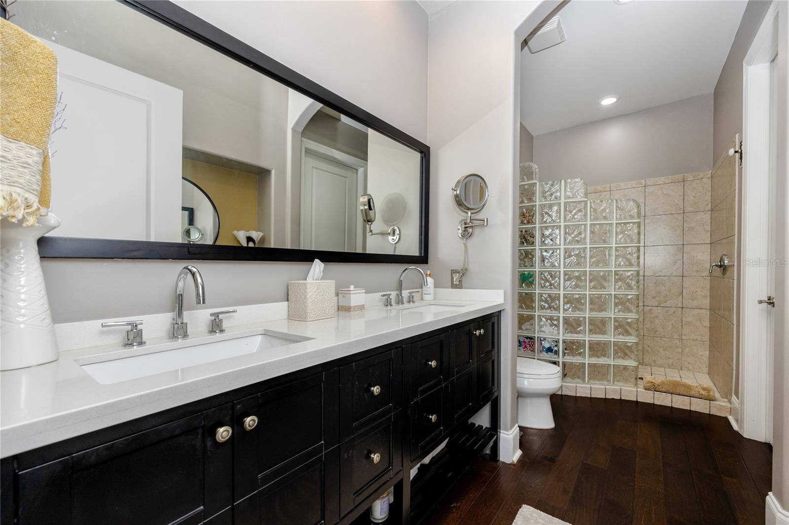 Master bathroom with dual vanity and walk-in shower