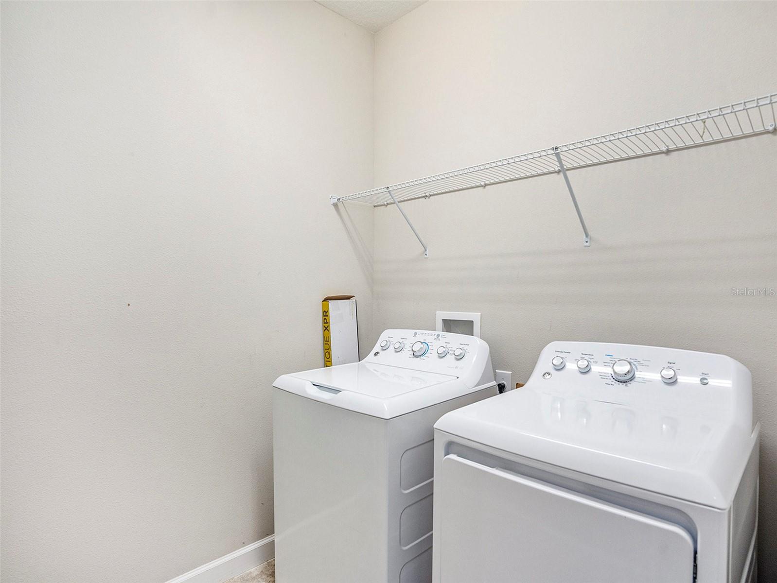 Laundry room located between the kitchen and the owner's suite