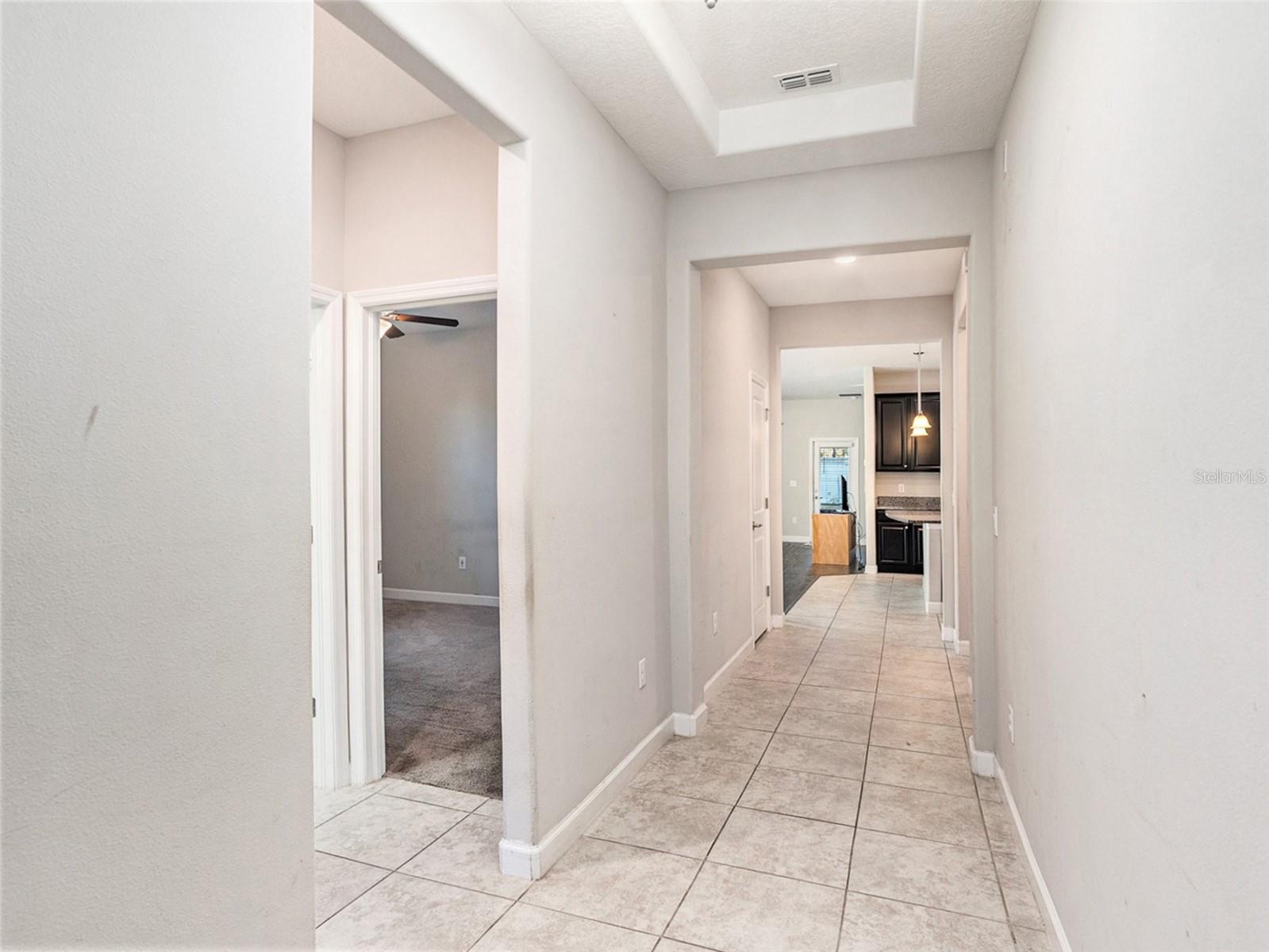 Entry hallway and the first two bedrooms to the left