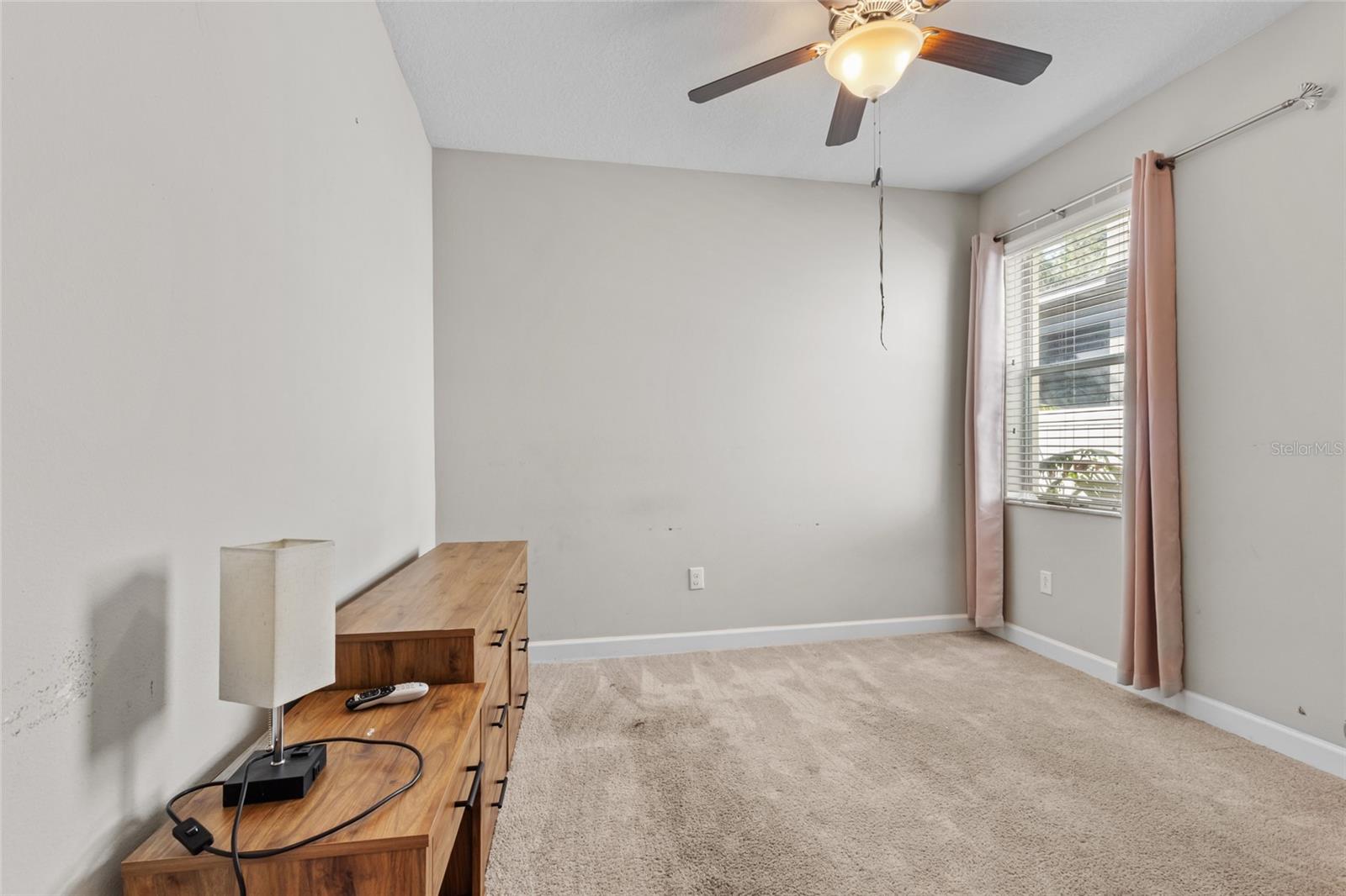 Secluded bedroom #3 with a full bathroom near the garage