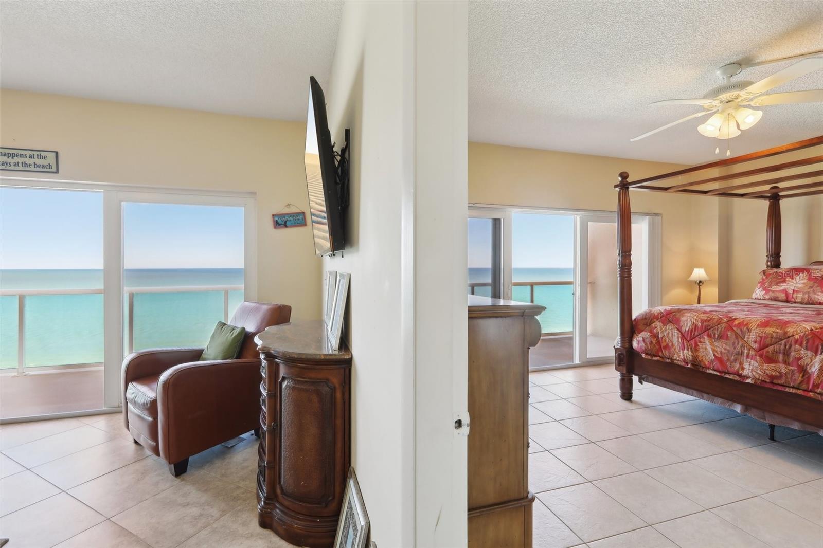 Standing between the living room and Master Bedroom -- both private patios visible.