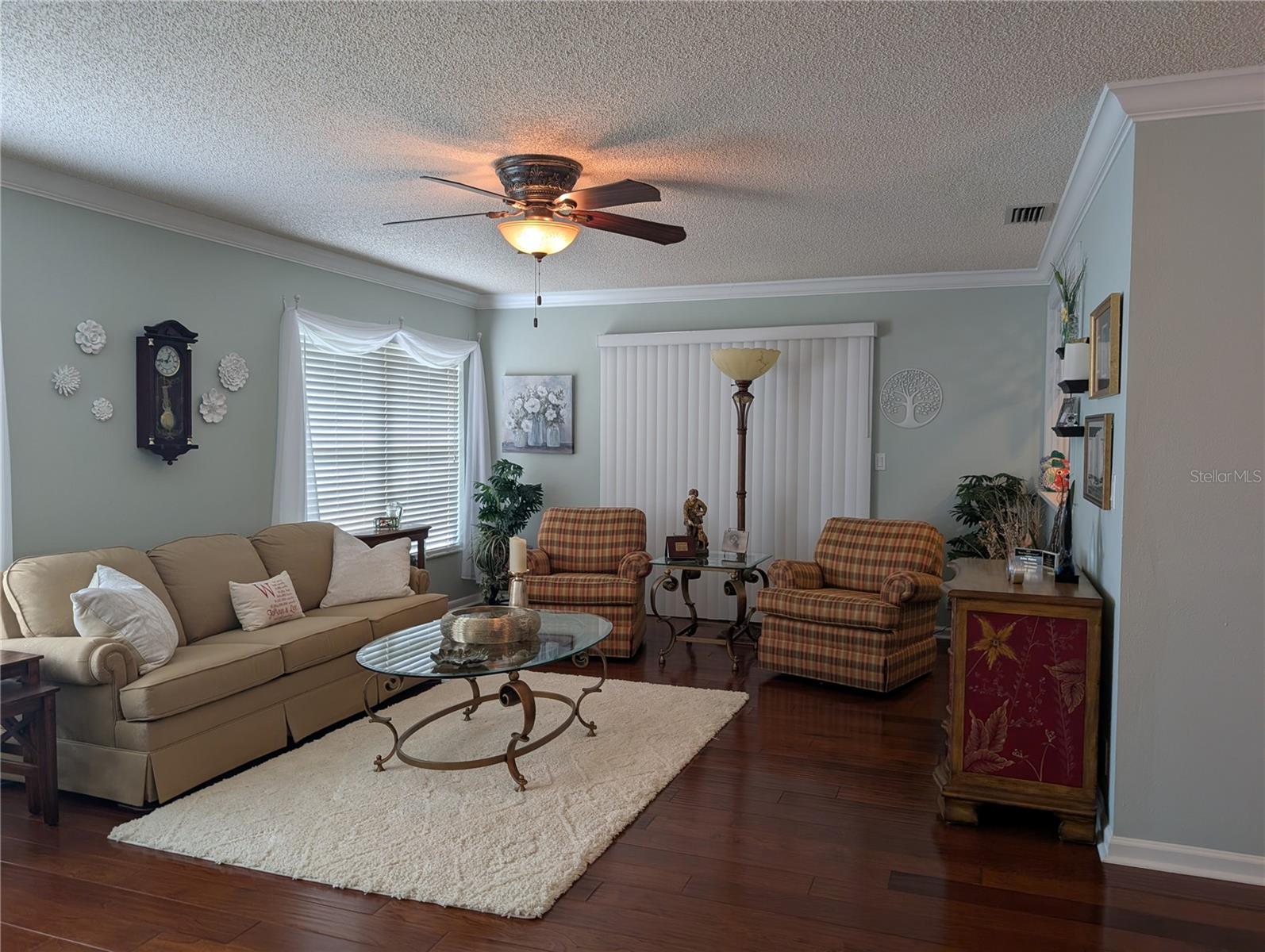 Florida room view of Bonus room door.  The warm tones and coastal flair carry thru to this room.  Two large windows provide view of private back yard...NO REAR NEIGHBORS.