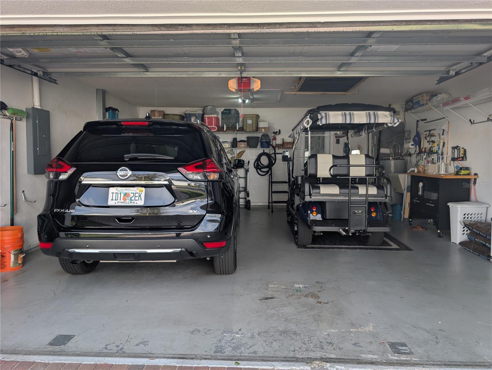 Overhead garage door is reinforced with windload posts installed when needed.  Craftsman door opener motor installed in 2021.