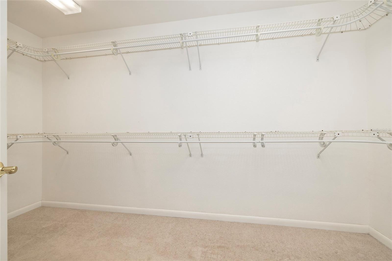 Primary walk-in closet in primary bathroom