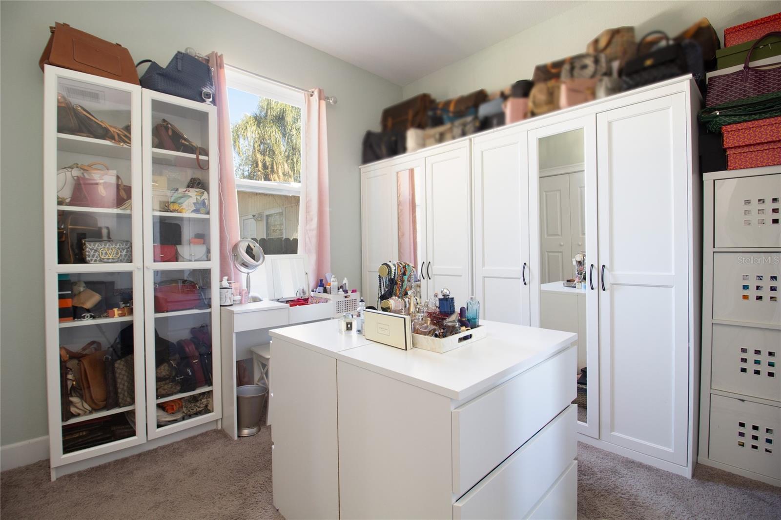 3rd bedroom being use as a dressing room. cabinets does not convey with the house