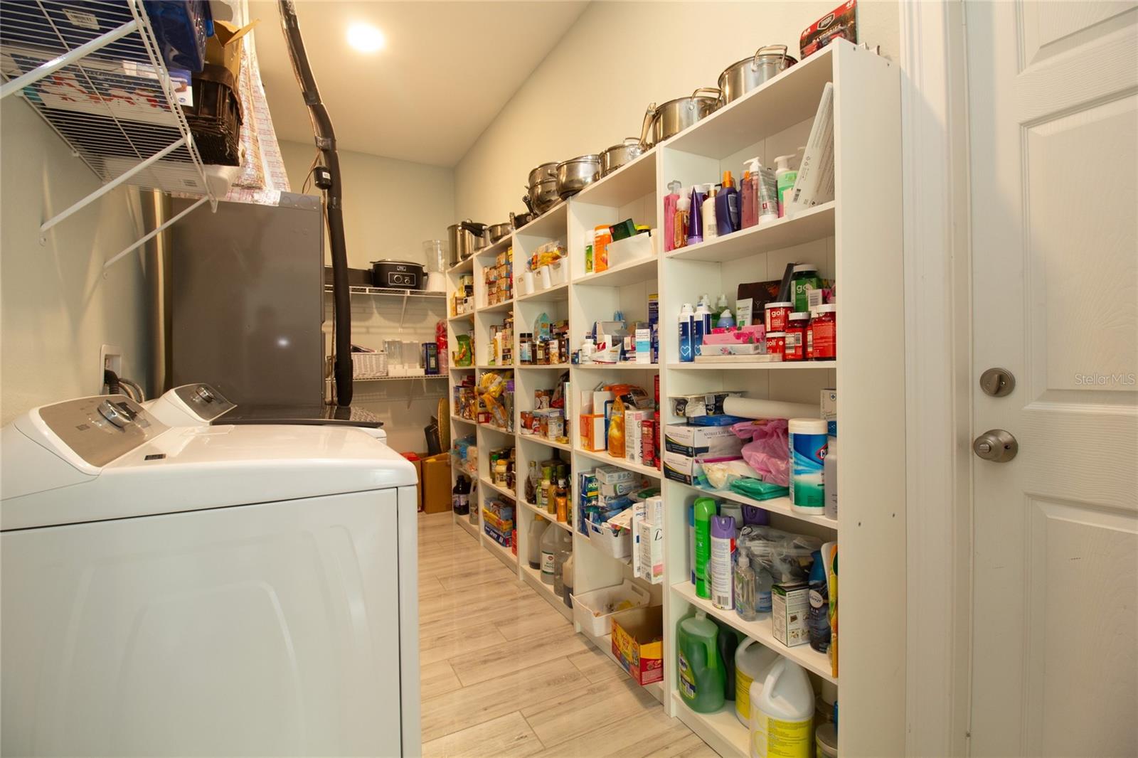 inside laundry with tons of storage