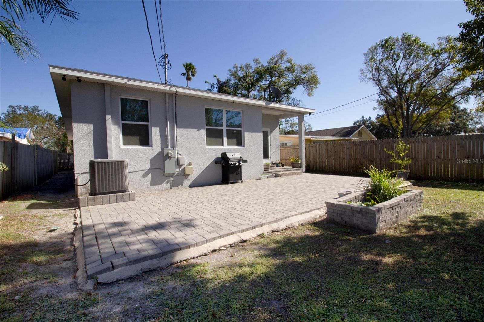 large paved backyard for entertaining