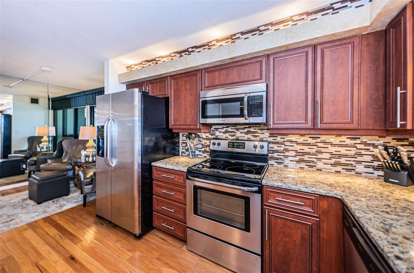 Kitchen is equipped with stainless steel appliances.