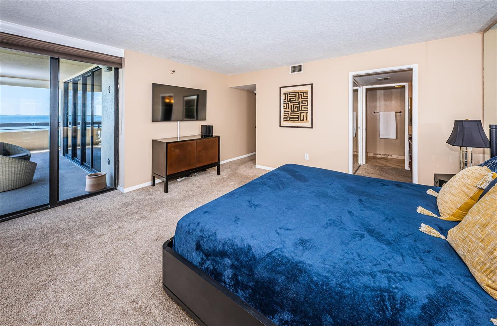 Primary Bedroom with private balcony access.