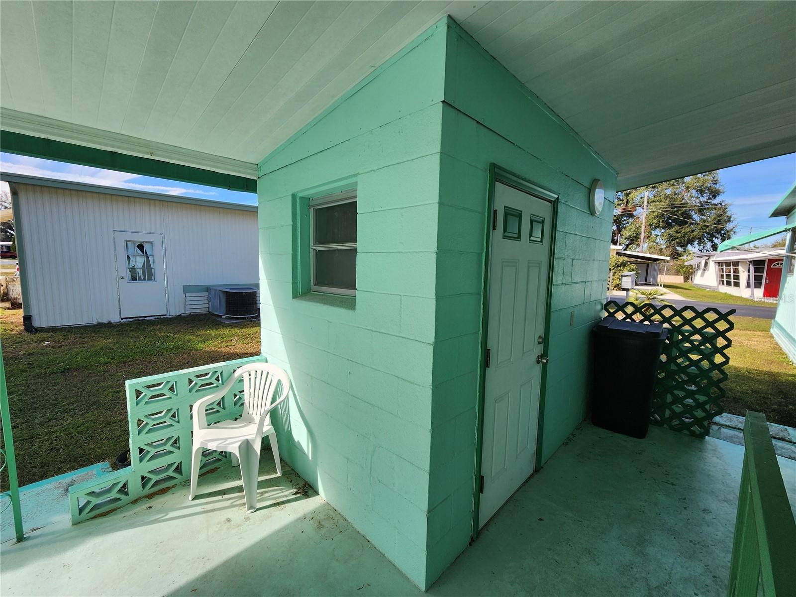 Cement block utility room.