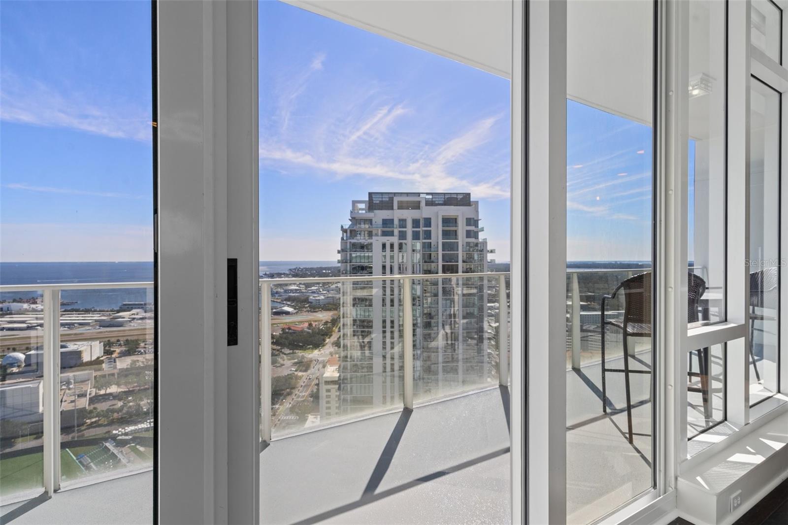 Private balcony off of the kitchen. Unparalleled views of the St. Petersburg marina, Albert Whitted Airport, Rowdies’ stadium, and the Grand Prix.