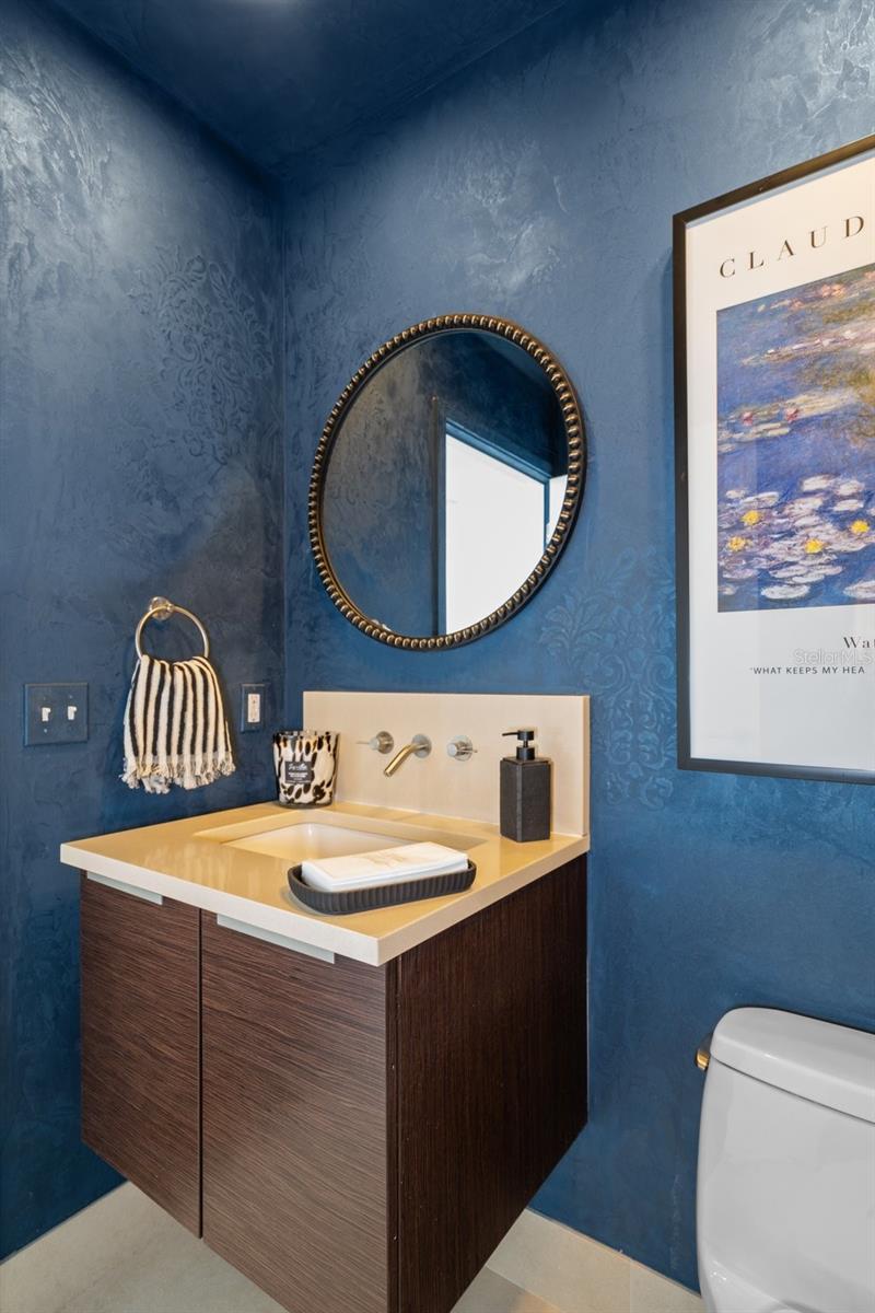 The powder bathroom off the living area provides easy access for guests while entertaining.