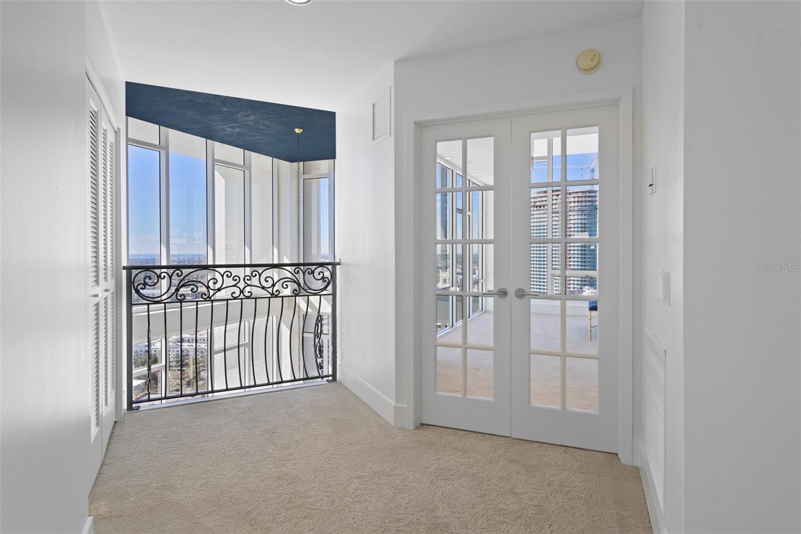 On the third level, beautiful French doors provide the private owner retreat access.