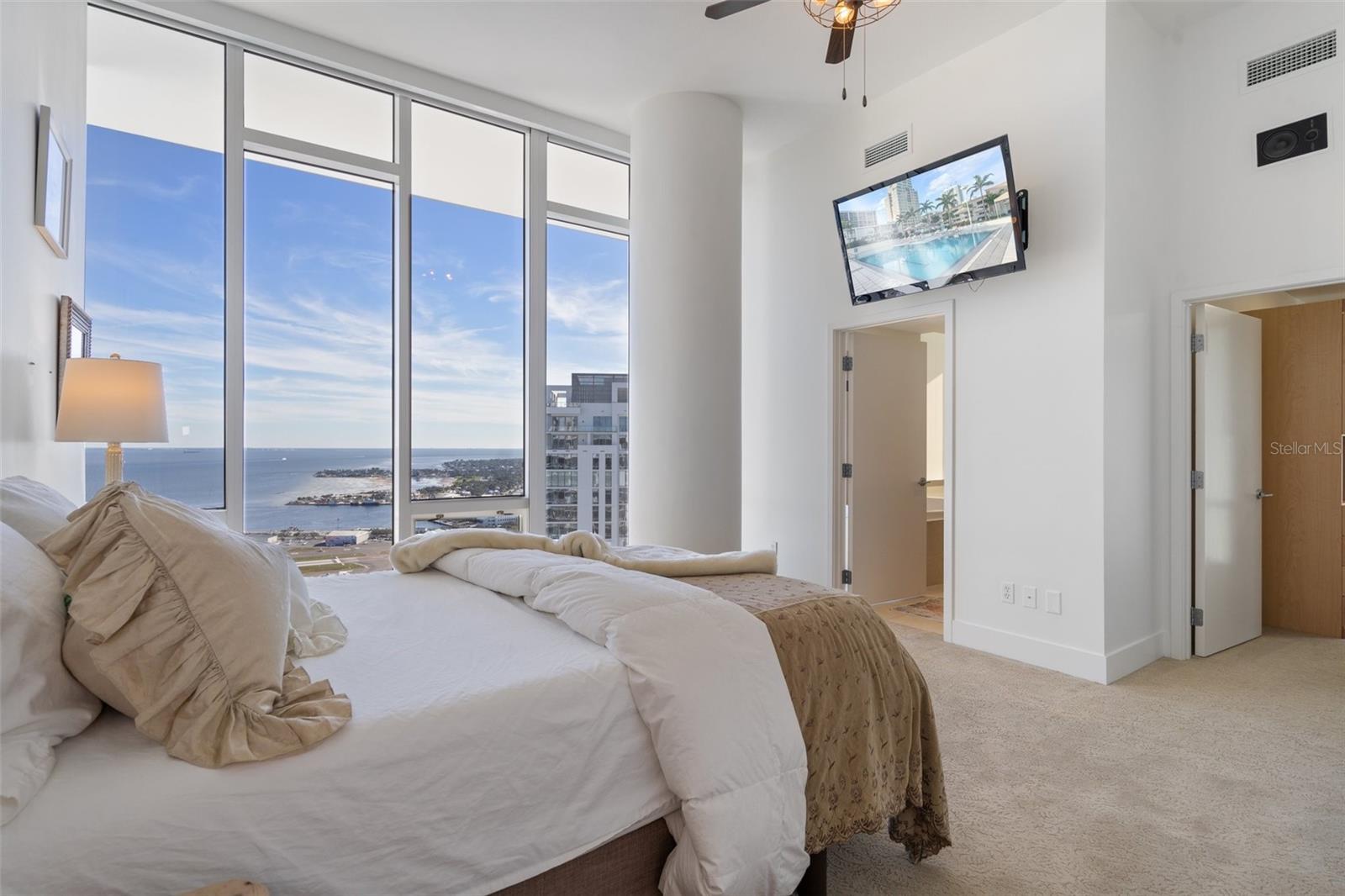 The guest bedroom on the third level has a large ensuite bathroom, a walk-in closet, and amazing views!