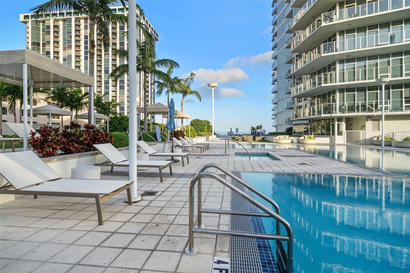 Plenty of furnishings by the pool to lounge in the sun or shade.