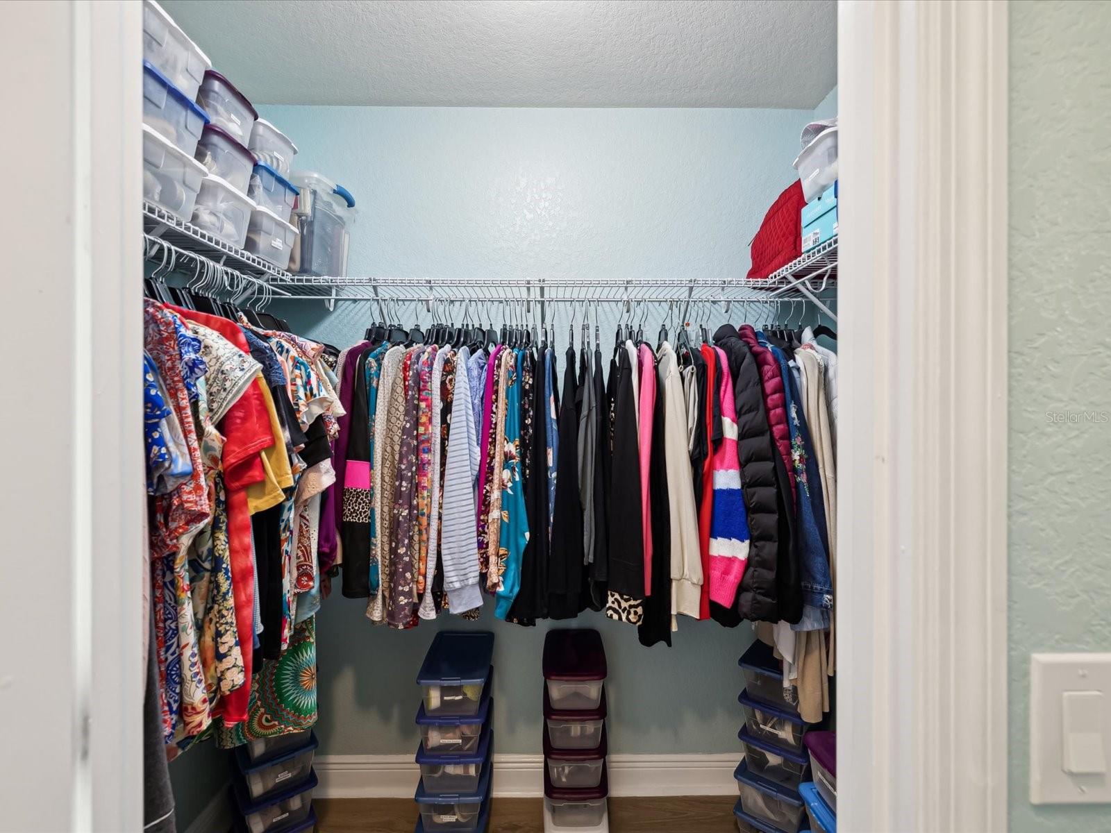 Primary Suite - Her Walk-in Closet