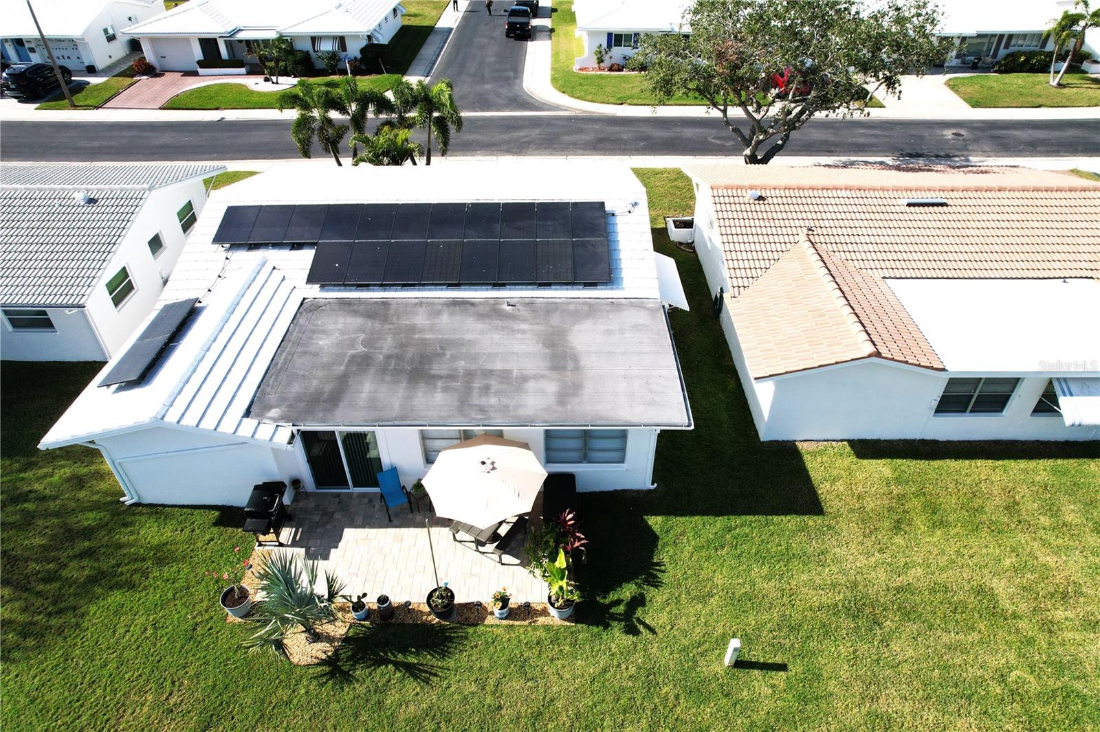 View of Back yard/Solar Panels on roof