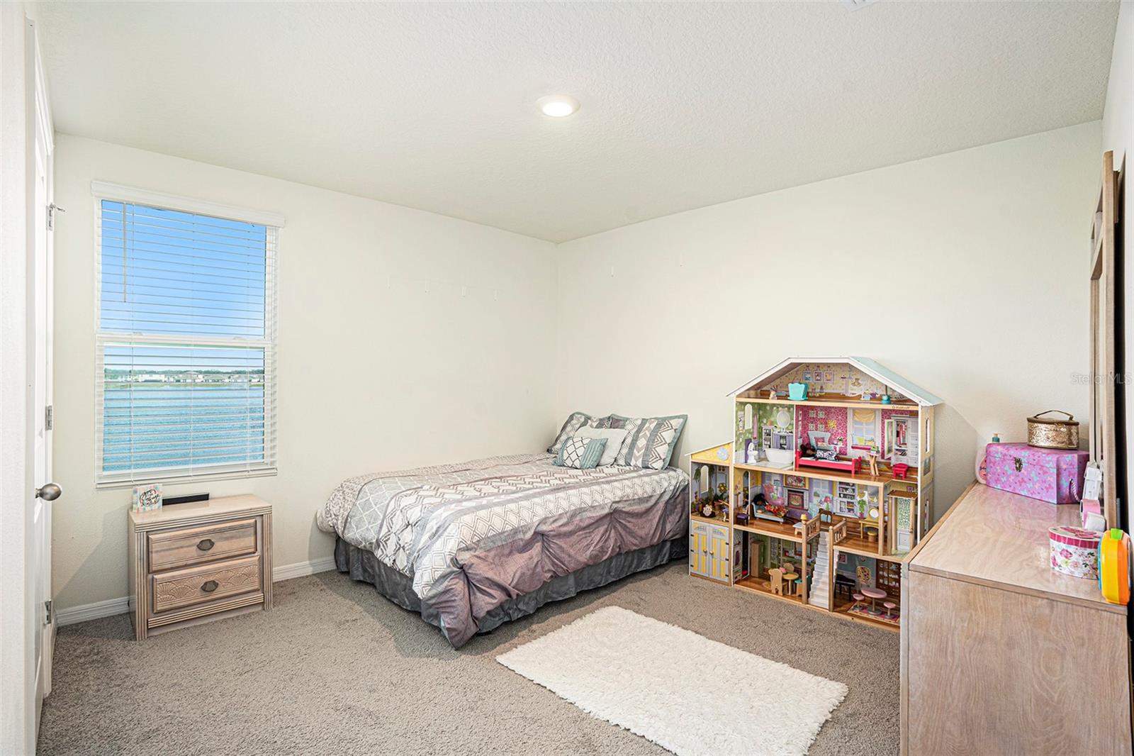 Spacious primary bedroom with generously sized walk in closet