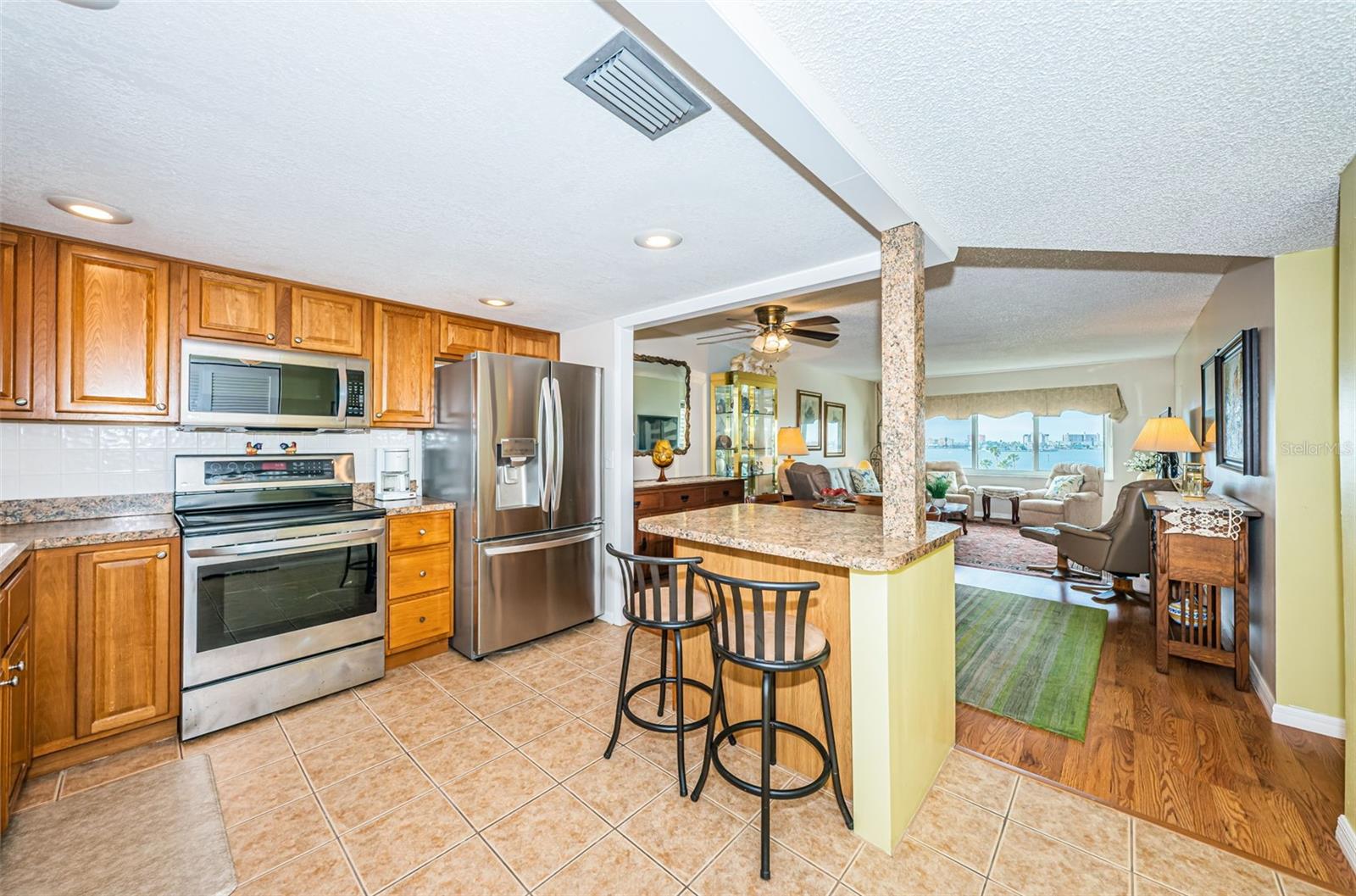 Open kitchen with stainless steel appliances