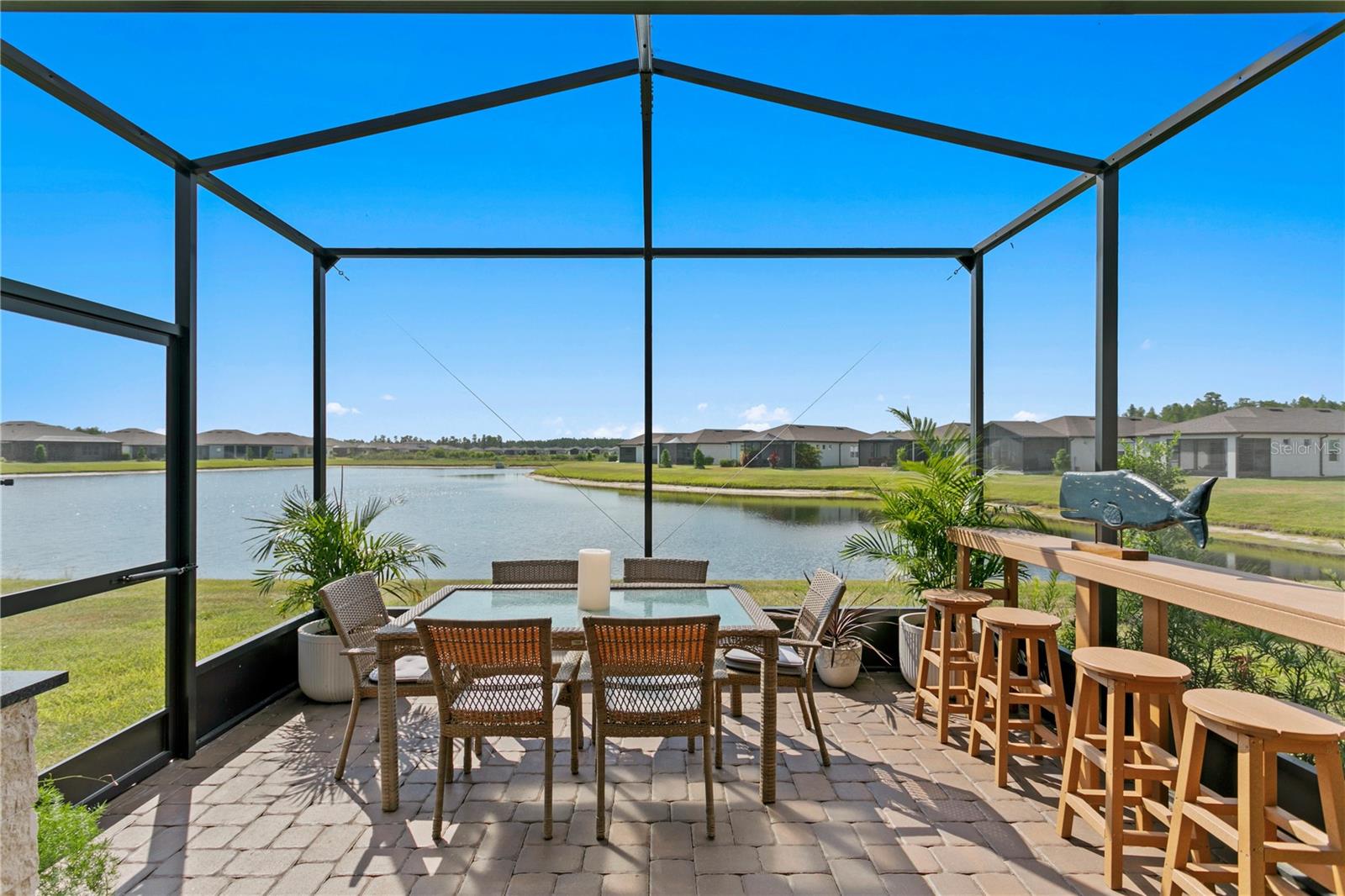 Birdcage lanai and pond view