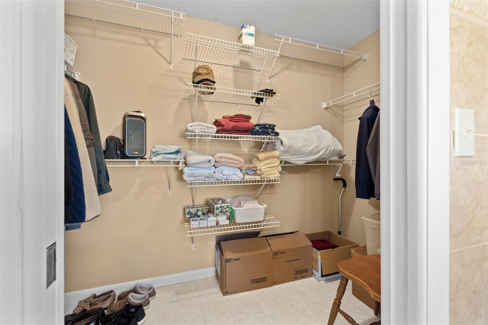 The primary walk-in closet offers additional storage space.