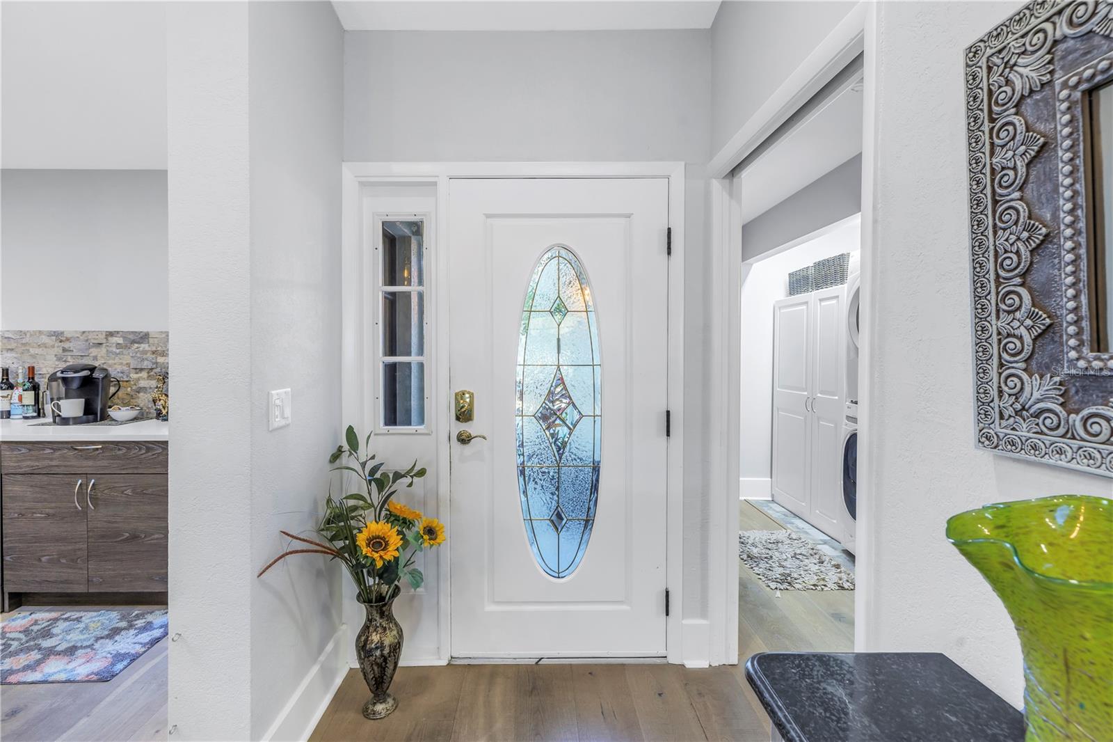 Front Door adjacent to kitchen and laundry