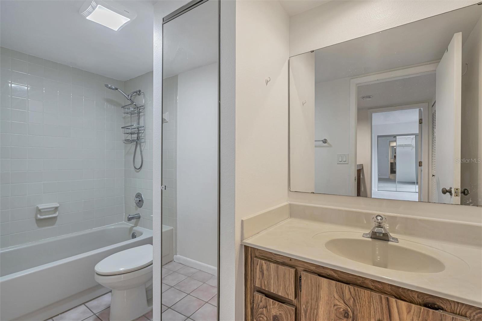 2nd full bathroom with tub shower and linen closet