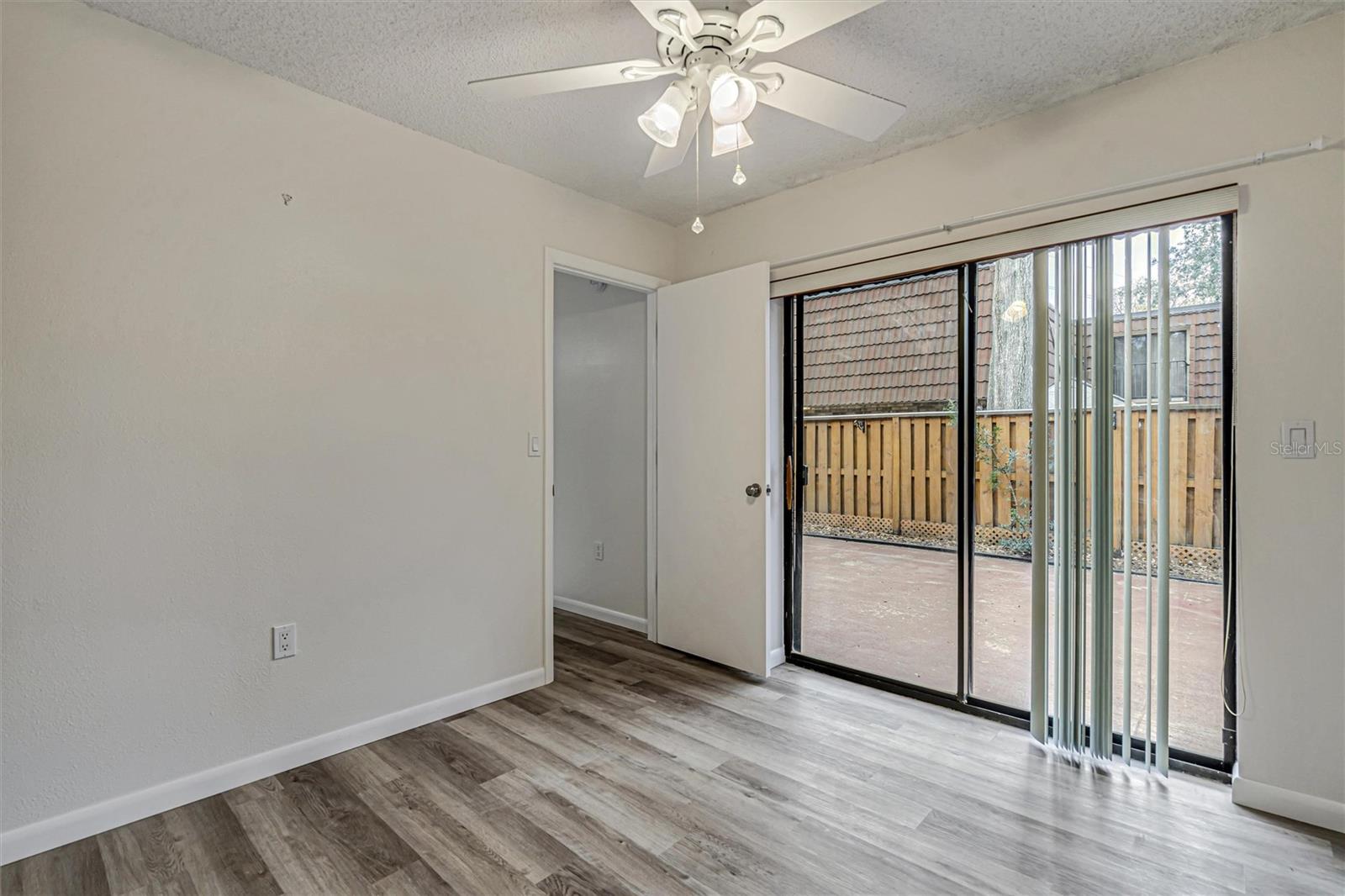 Living room with new luxury vinyl flooring and fresh interior paint