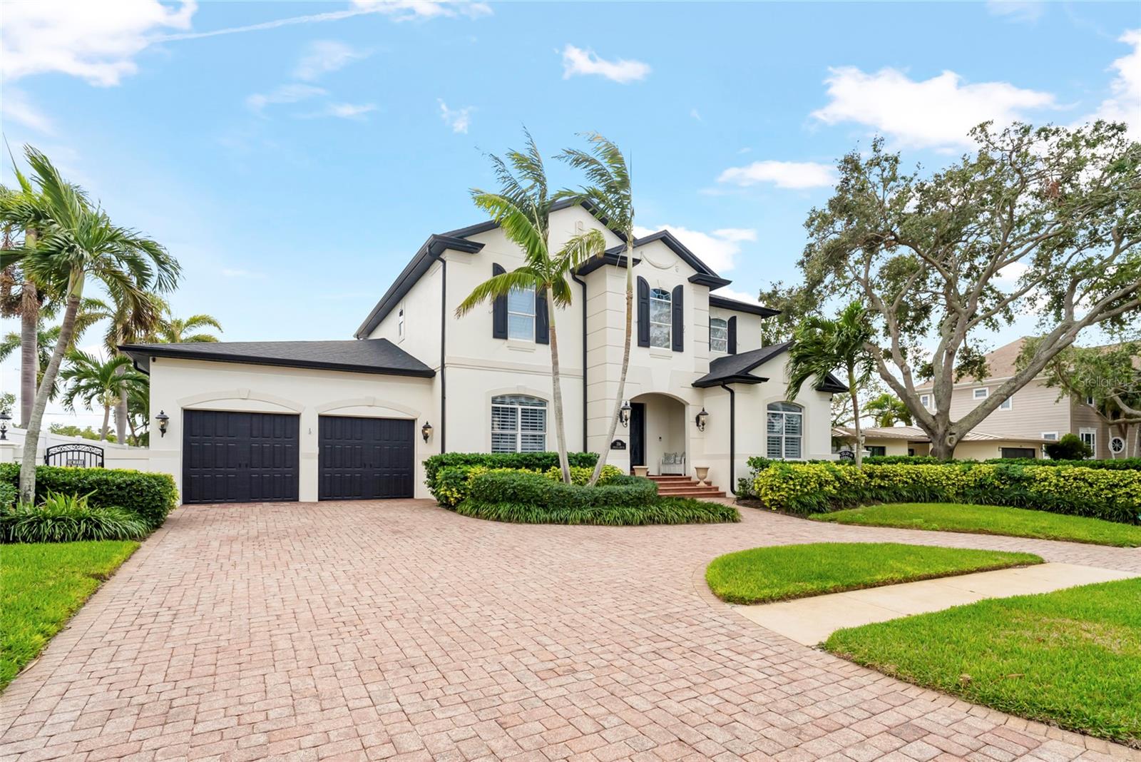 Circle driveway and 2 car garage provide parking for family and friends