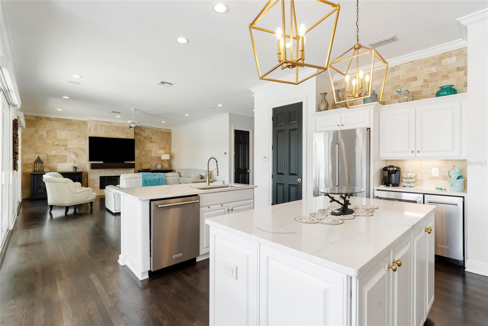 Dual kitchen islands open to the family room