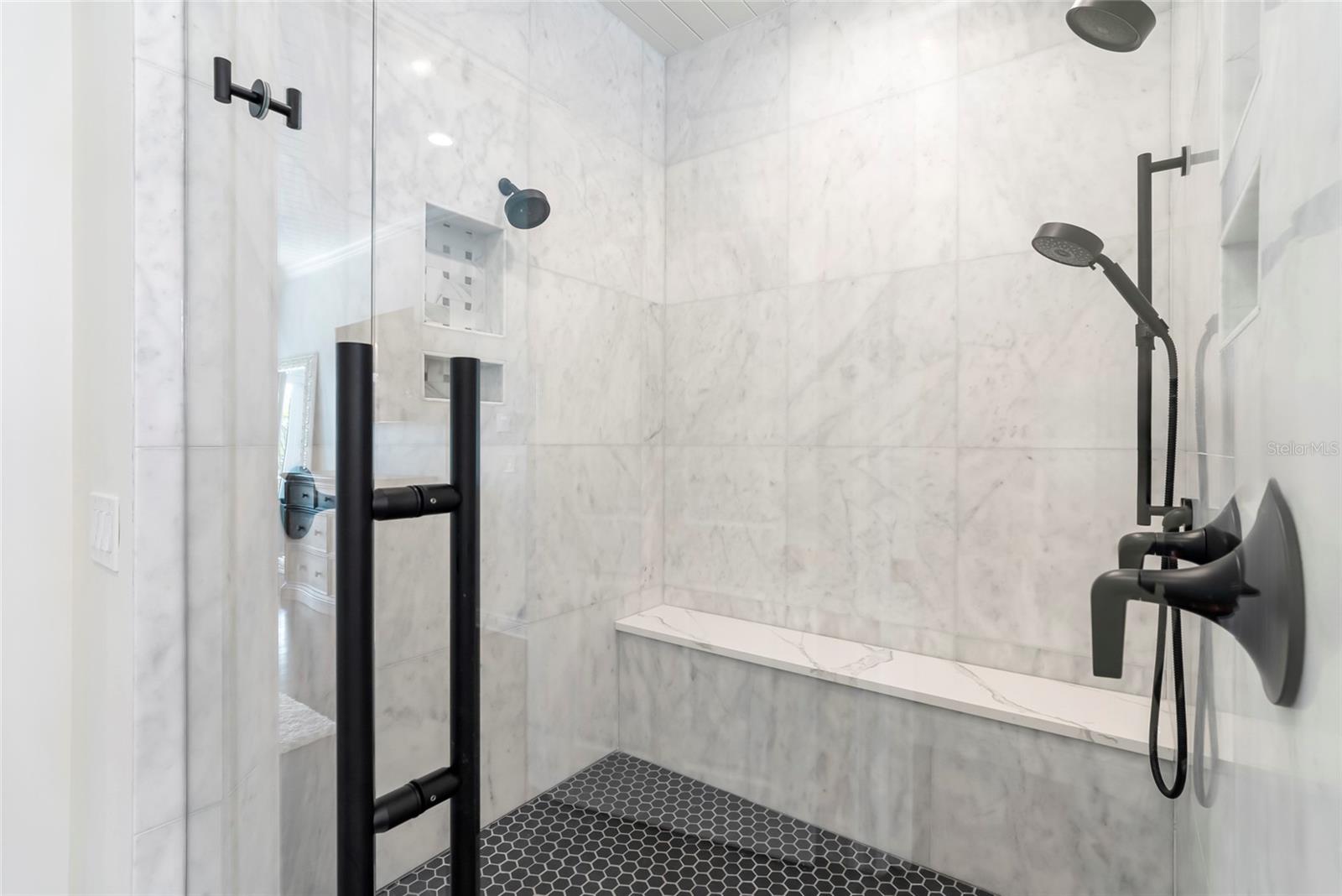 Walk-in shower with dual showerheads