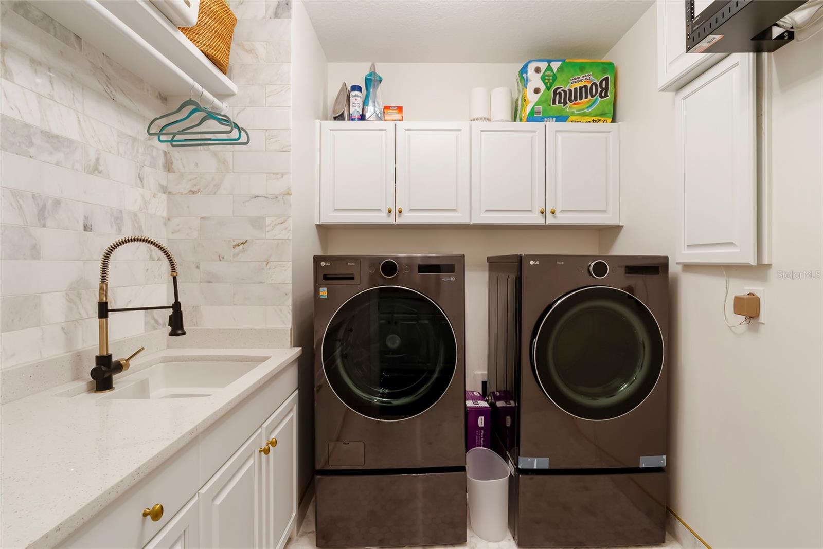 Laundry room with laundry shoot