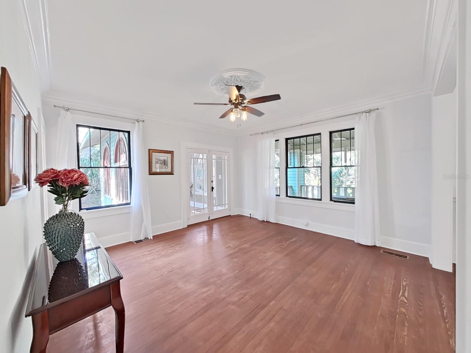 French doors lead to Sun Room.   Imagine the grand dinners in 1910