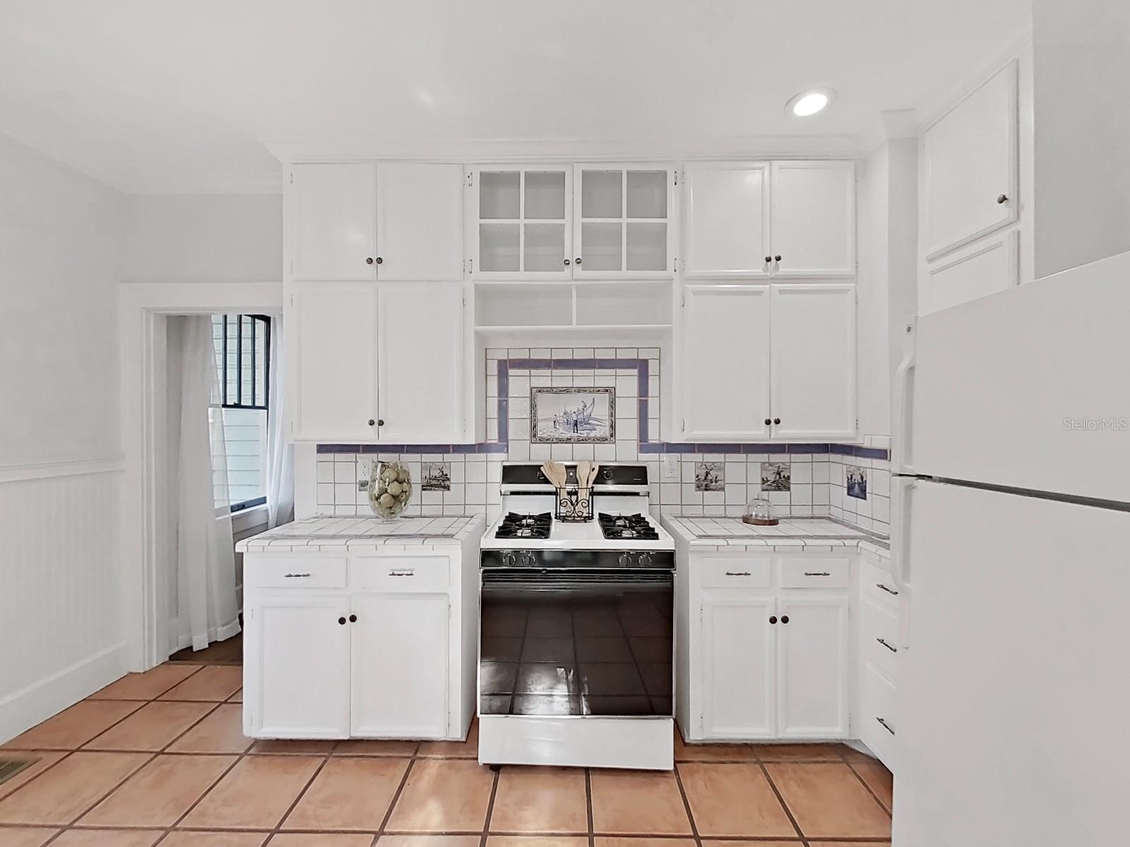 Kitchen opens to dining room as well as breakfast area