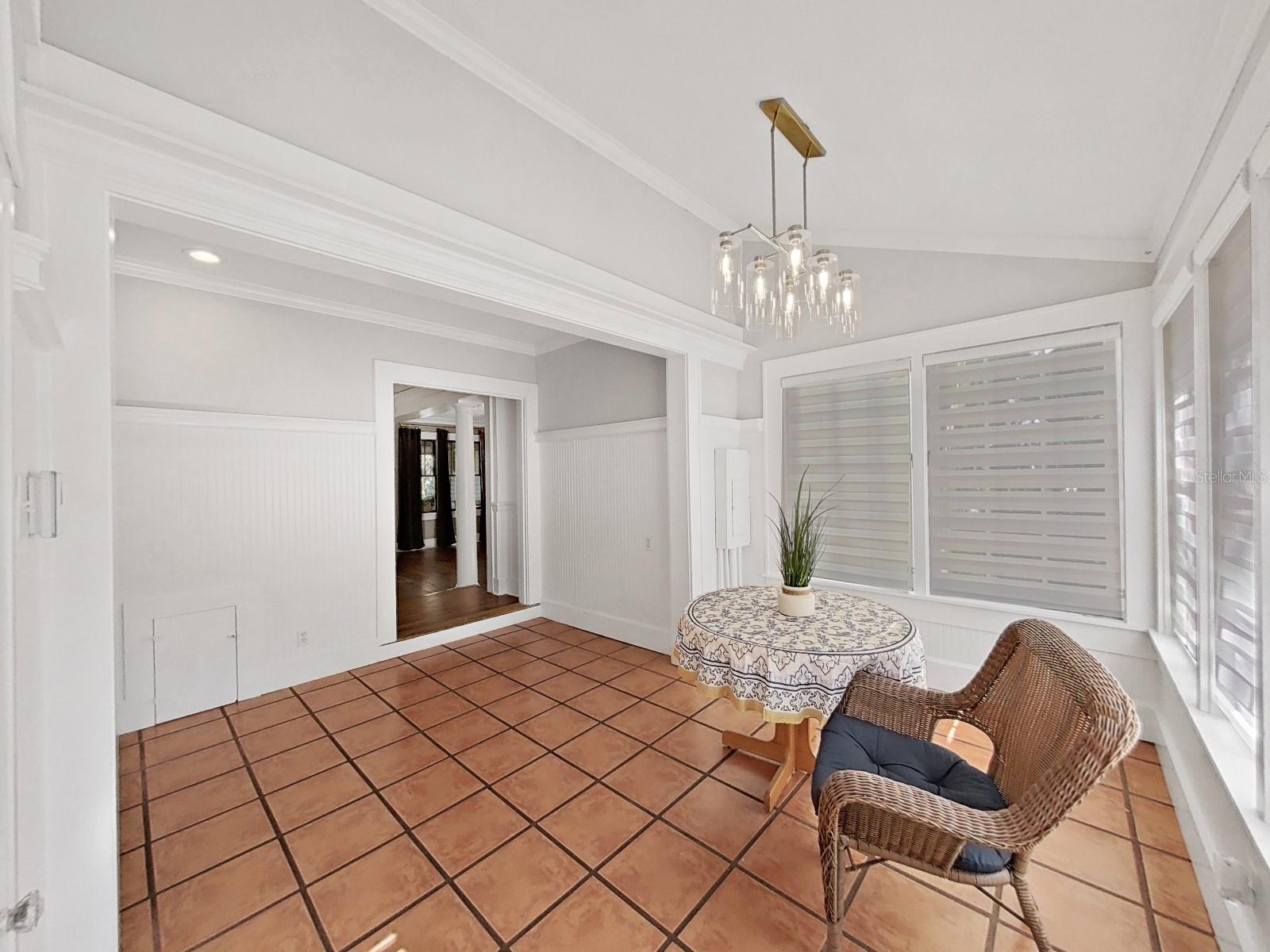 Enter the back door into breakfast room with beadboard. Crown molding.