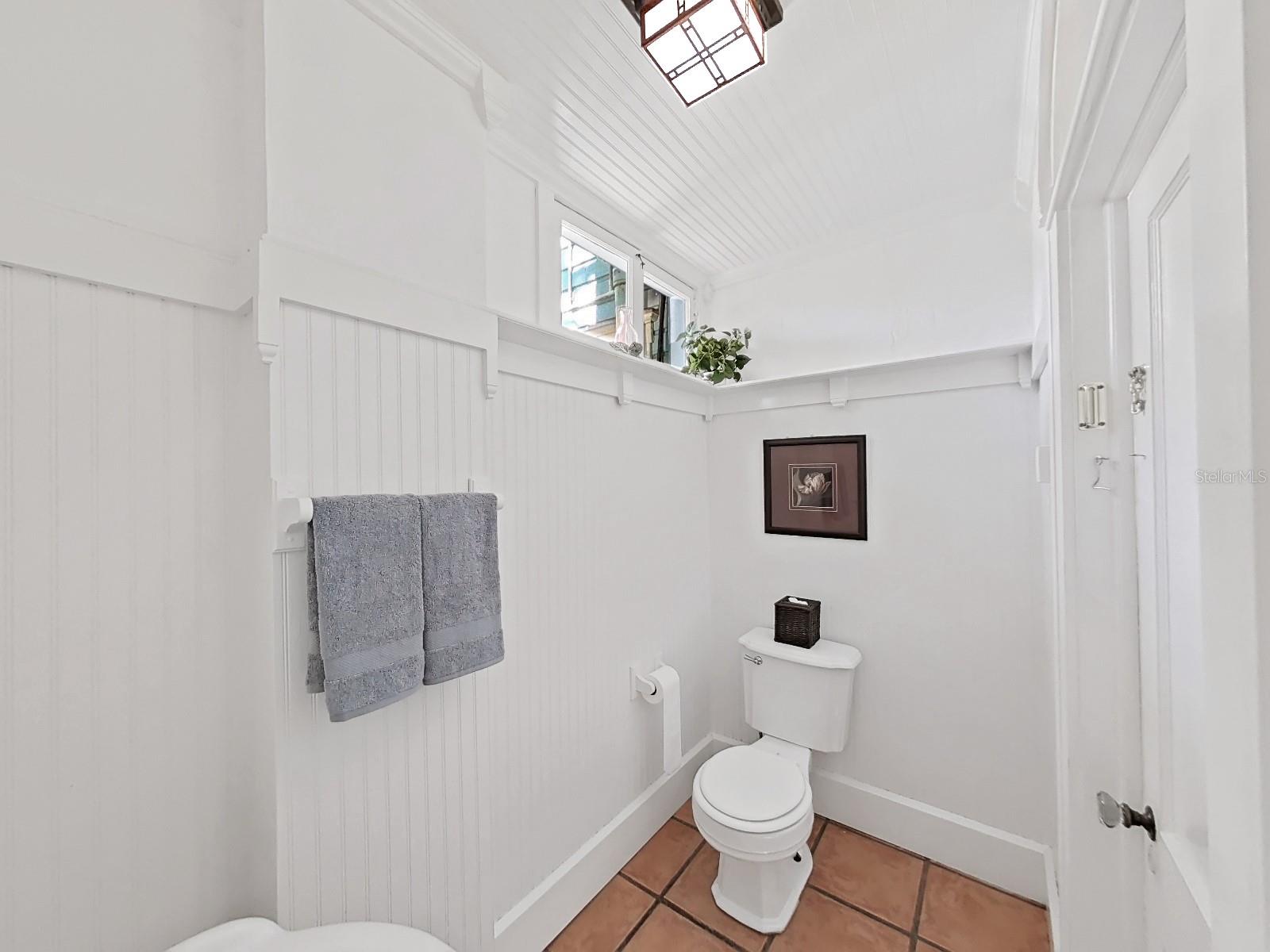 Half bath again with beadboard and shelf to display favorite items