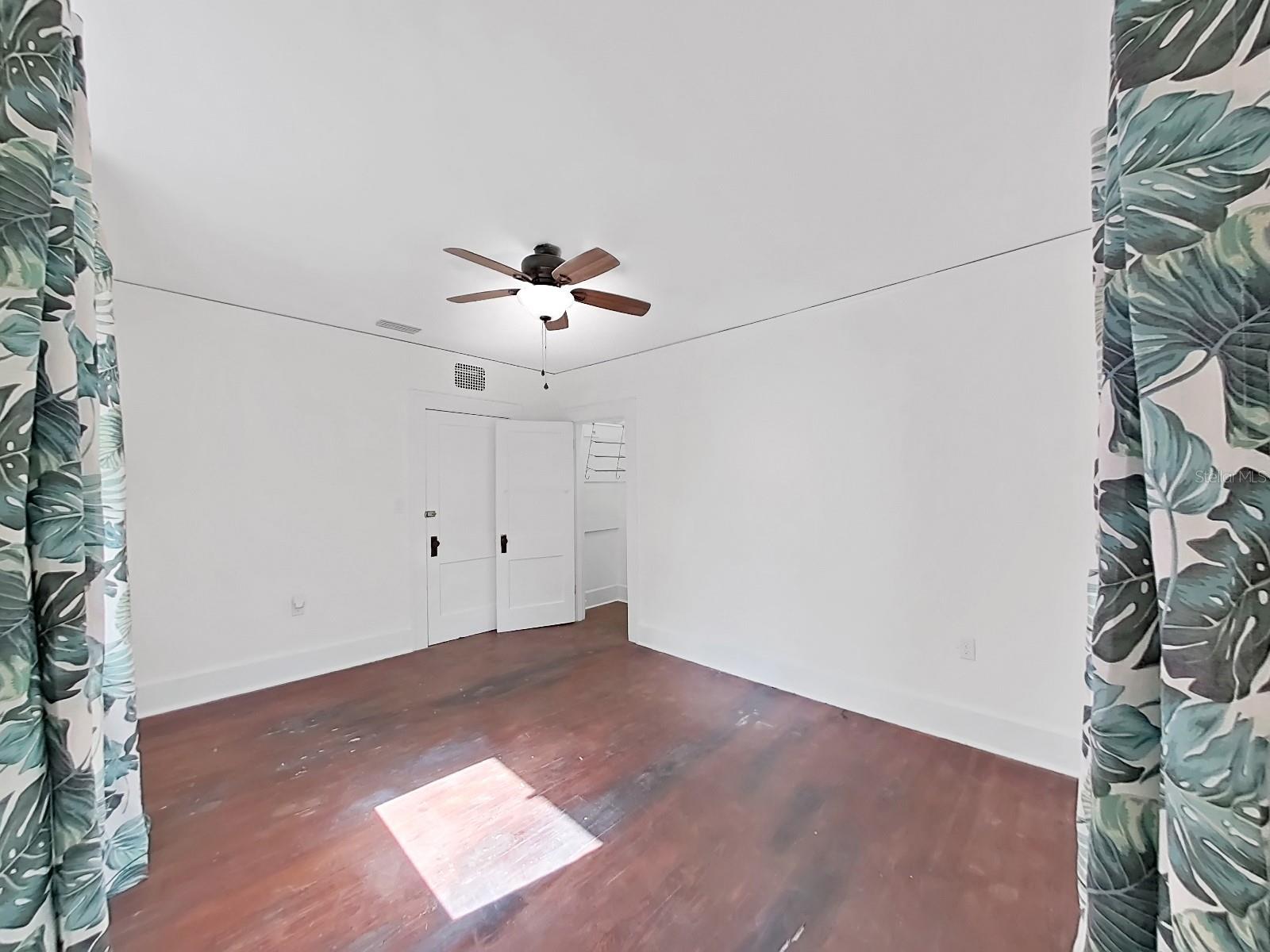 2nd bedroom.  Original heart pine floors from 1910. Can be restored and refinished