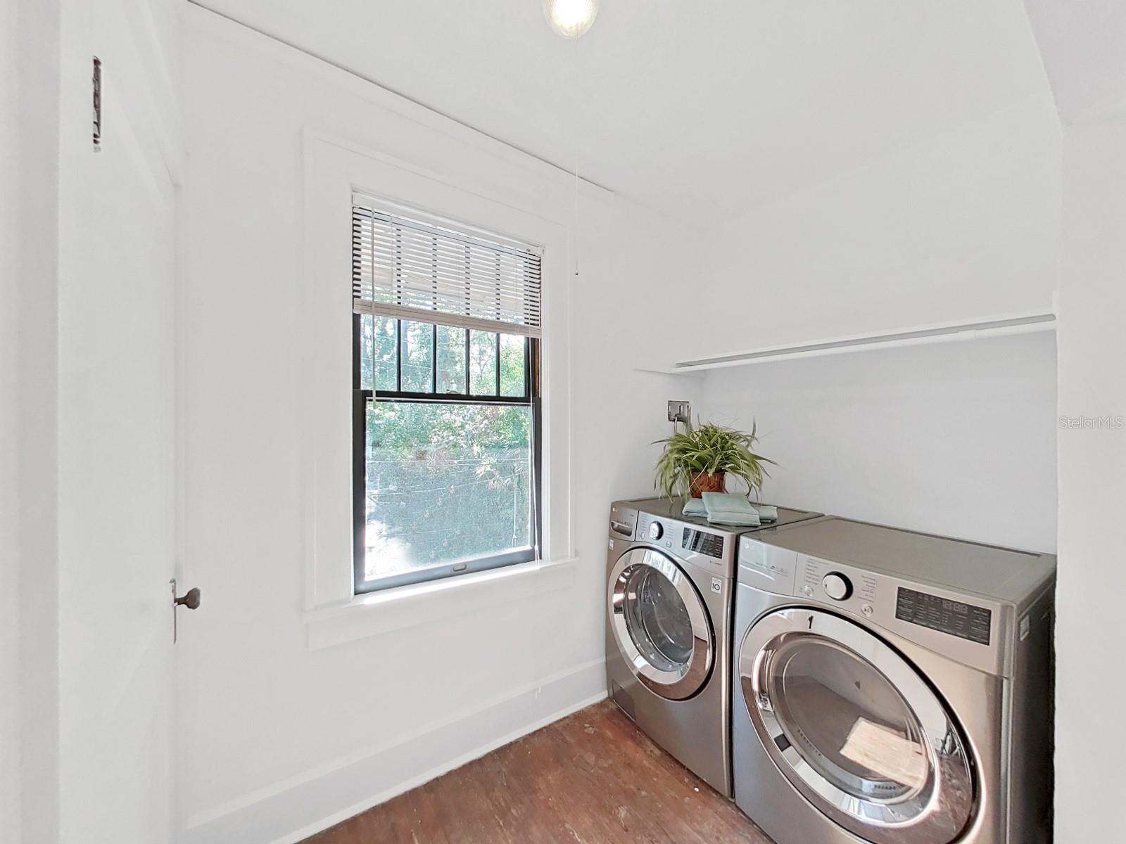 Upstairs laundry with newer LG washer and gas dryer.  Closet in area.