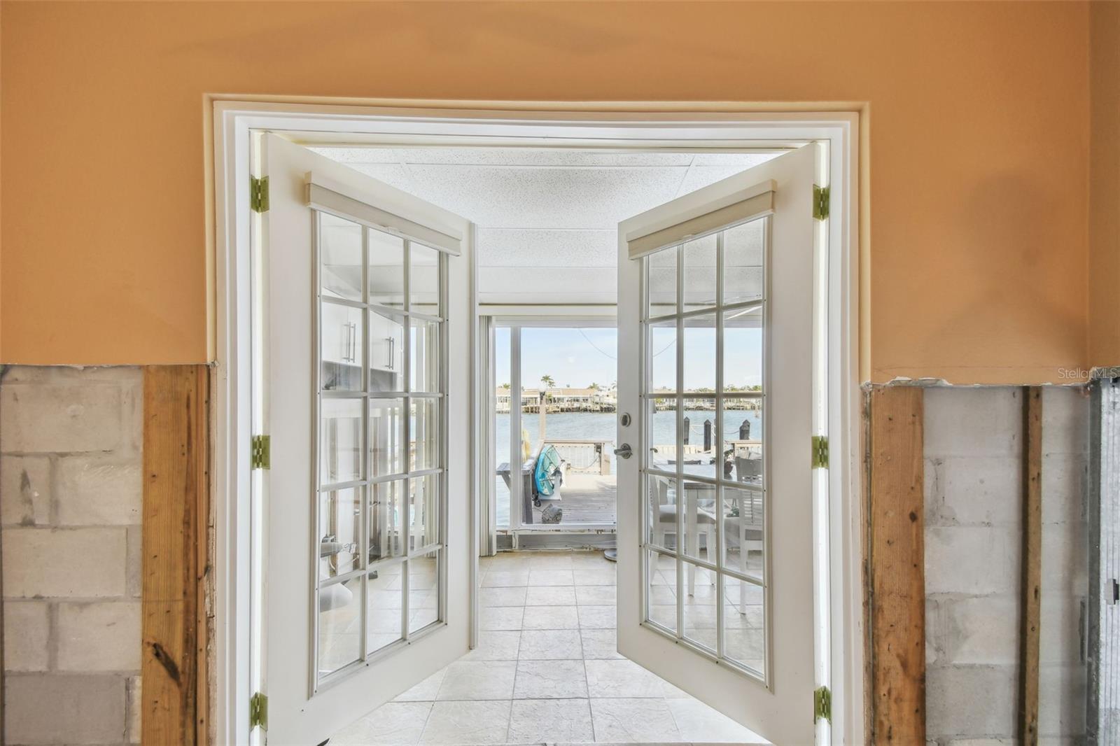 Primary Bedroom with french doors to Fla Room