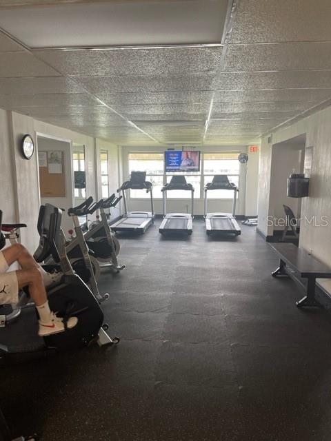 Workout room with TV and bathrooms