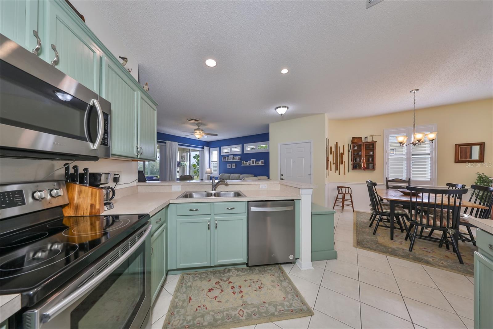 Exceptionally clean, open and spacious kitchen perfect for entertaining, is bright and happy.