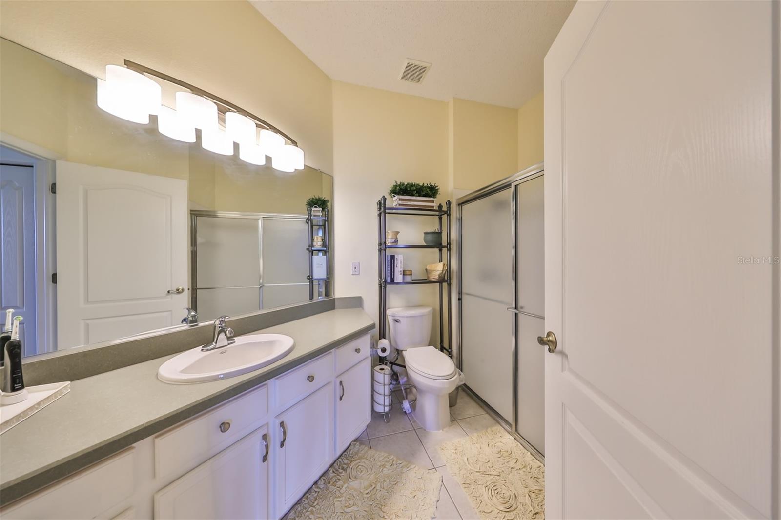 The primary ensuite bathroom is large with a shower, and large vanity.