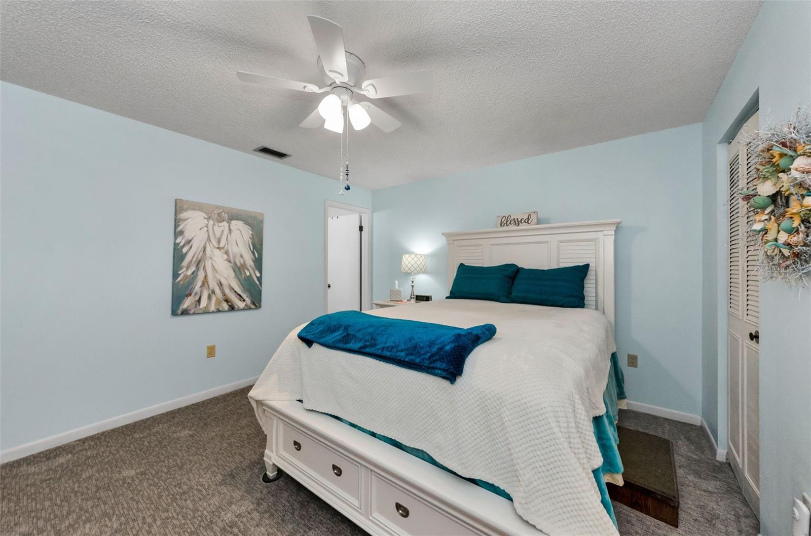 Main/Primary bedroom with lart walk in closet and ensuite bathroom. walk in shower no tub