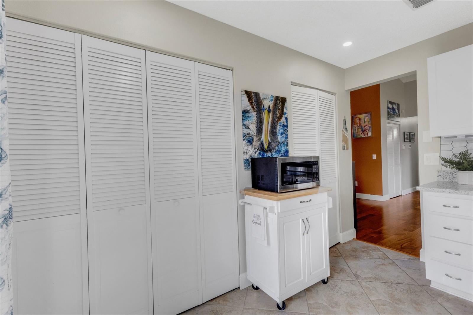 Laundry behind doors in kitchen