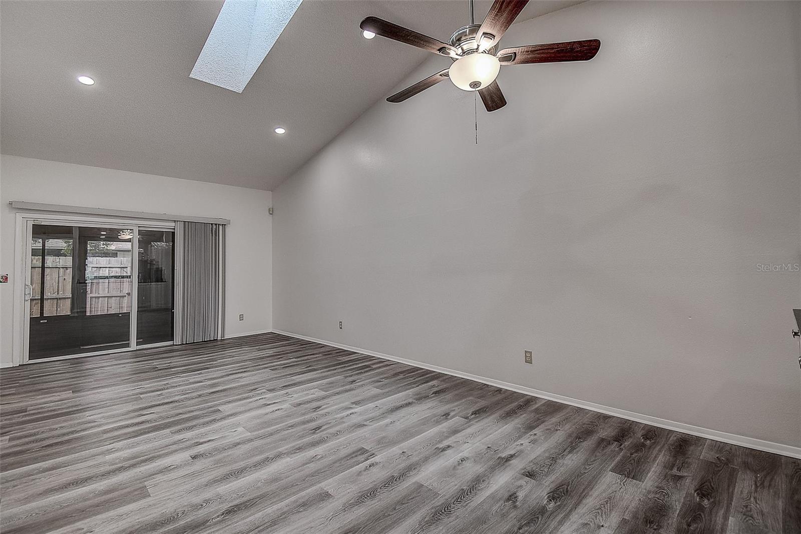 Vaulted Ceiling in Living room with new skylight for loads of sunlight!