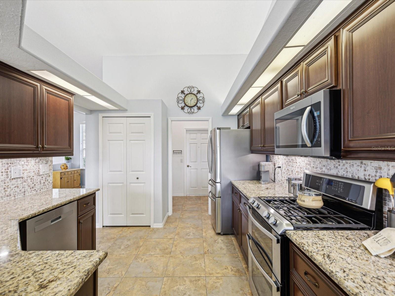 Kitchen, view of pantry and Laundry room to the garage